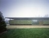 The concept is based on the ever-changing color and positioning of the hay as cladding on the barn. When hay is stacked along the outer storage shelves in the winter, it is green; as the season unfolds, the hay turns yellow, and the caretaker removes it from the shelves as it is used for feed. Photo of Somis Hay Barn modern home