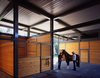 The steel structural system is designed based on a simple grid, constructed to the ideal dimensions for a horse stable. Natural ventilation is encouraged via open clearstories, and the large roof overhang protects the cladding from the rain. Photo 5 of Somis Hay Barn modern home