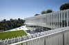 In plan, the structure is an L-shape, embracing the view across its angled infinity pool. Photo of Oberfeld Residence modern home