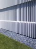The vertical louvers provide a unique architectural contrast to the building’s strong horizontal elements. Photo 3 of Oberfeld Residence modern home