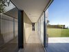Clad in glass and shielded from the sun’s intensity by a series of custom-designed vertical louvers, cut from the same cement panel material that wraps the street façade of the home. Photo 4 of Oberfeld Residence modern home