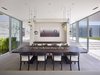 The composition of the home itself is fluid: blending indoor and outdoor spaces with subtle divisions and natural material integration throughout. Photo 5 of Oberfeld Residence modern home
