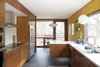 Kitchen with lovingly restored, original cabinets. Photo 5 of The Soulek House modern home