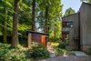 Modern home with Shed & Studio. Treehouse Shed by Gardner Architects LLC is part of a masterplan that manages stormwater, creates a habitat for indigenous species, and embraces the neighboring trees—thereby preserving the quality of the community. Photo of Treehouse Shed