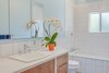 Modern home with Ceramic Tile Floor, Wood Cabinet, Pendant Lighting, Subway Tile Backsplashe, Drop In Sink, Bath Room, One Piece Toilet, and Subway Tile Wall. Terra Linda bathroom remodel Photo 2 of Terra Linda Bathroom Remodel