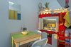 Fireplace converted into a storage cabinet. Photo 10 of Beachside Bungalow Studio modern home