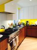 Yellow, white, walnut kitchen Photo 3 of At Home With Art modern home