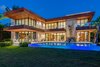 An infinity-edge pool and deep-cantilevered overhangs create the perfect ambiance for outdoor entertaining. Photo 2 of North Bay Road Residence modern home
