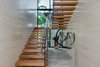 A modern floating staircase creates emphasizes transparency. Photo 9 of North Bay Road Residence modern home
