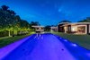 The backyard at twilight. Photo 16 of Ponce Davis Residence modern home