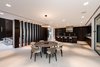 Modern home with Dining Room, Table, Chair, Recessed Lighting, and Limestone Floor. Adjacent to the kitchen and living area is the home's dining room. Photo 7 of Palm Island Residence