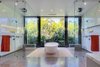 Modern home with Bath Room, Recessed Lighting, Enclosed Shower, Freestanding Tub, and Marble Wall. A stand-alone tub sits between the two glass-enclosed showers. Photo 12 of Palm Island Residence