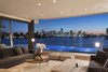 Modern home with Bench, Coffee Tables, Sofa, Table Lighting, Ottomans, Recessed Lighting, Outdoor, Light Hardwood Floor, Trees, Stone Patio, Porch, Deck, Infinity Pools, Tubs, Shower, and Back Yard. A sitting area opens up on two sides giving guests a panoramic view of Downtown Miami. Photo 3 of Casa Ischia