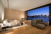 Modern home with Bedroom, Night Stands, Bed, Ceiling Lighting, Table Lighting, Accent Lighting, and Light Hardwood Floor. Upstairs, a mini-master bedroom features a stone wall, White Oak wood floors and an expansive view of the water. Photo 4 of Casa Ischia