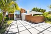 Ipe wood and white stucco were used for the home's exterior. Photo of Rivo Alto Residence modern home