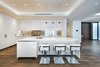 Modern home with Kitchen, Metal Backsplashe, Recessed Lighting, Medium Hardwood Floor, and White Cabinet. The open-concept kitchen boasts a large island and custom Boffi kitchen with double Subzero and Miele appliances. Photo 5 of Rivo Alto Residence