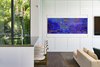 A built-in saltwater aquarium brightens up the white walls of this living room. Photo 7 of Rivo Alto Residence modern home