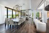 The formal dining room seats twelve and is located next to the wine cellar with views of the bay. Photo 9 of Rivo Alto Residence modern home