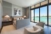 Oversized glass balconies allow for non-disruptive views of the water from the bedroom. Photo 11 of Rivo Alto Residence modern home