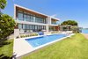 The rear of the residence features a pool, hot tub, outdoor kitchen and dining area. Photo 14 of Rivo Alto Residence modern home