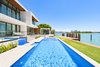 Modern home with Outdoor, Back Yard, Infinity Pools, Tubs, Shower, and Lap Pools, Tubs, Shower. The pool in the backyard leads to the home's massage room - a separate structure located in the rear of the residence. Photo 15 of Rivo Alto Residence