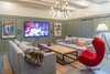 A snug screening room, located on the lower level, has a radiant heated floor. A bar, and a half bath are located conveniently adjacent. Photo 3 of Corkin House modern home