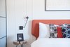 Modern home with Bedroom, Bed, Night Stands, and Wall Lighting. Throw pillows are like the costume jewelry of a bedroom—they put on the finishing touches to a space and help provide a pop of color, yet they can easily be switched out when a trend is no longer in style. Photo 7 of A Serenity Escape in Joshua Tree