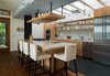Modern home with Kitchen, Cooktops, Refrigerator, Wall Oven, Medium Hardwood Floor, Wood Cabinet, Concrete Counter, Porcelain Tile Backsplashe, Pendant Lighting, Undermount Sink, Slate Floor, Open Cabinet, Recessed Lighting, and Track Lighting. Kitchen Photo 6 of House on Little Round Bay