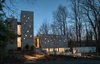 Modern home with Exterior, Beach House Building Type, Butterfly RoofLine, Stucco Siding Material, Flat RoofLine, Metal Roof Material, House Building Type, and Wood Siding Material. Land side Elevation Photo 18 of House on Little Round Bay