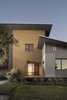 The house has opposing shed-style sloped rooflines and the exterior is faced with a collage of materials including Hardie board, Fry Reglet architectural metal, corrugated metal siding panels and stucco. Photo 18 of 1600 Lakeside modern home
