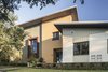 Young faced his home with a collage of exterior materials including Hardie board, Fry Reglet architectural metal, corrugated metal siding panels and stucco. Photo 9 of 1600 Lakeside modern home