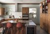 It was important to the Youngs to use local talent wherever possible. The kitchen cabinets and all of the mill work were locally fabricated. The breakfast counter is supported with an old tire jack -- the kind of found object that appeals so much to Young and that he finds uses for in details throughout the home, inside and out. Photo 11 of 1600 Lakeside modern home