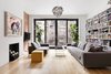 Family room, leads to terrace with skylights illuminating lower level Photo 3 of Uptown Loft modern home