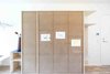 Modern home with Storage Room and Cabinet Storage Type. To meet this demand, Spacon & X has designed a Check-in module that has a dedicated cabinet for each child of the family. The surfaces have been made in perforated wood - making the cabinet light and graphic at the same time, while crossing rubber bands gives the children the opportunity to hang up their own drawings and pictures on their personal cabinet. This makes it easy for the children to know where to put and find their stuff. Furthermore, the cabinets are built with a seating-spot at the end where you can tie the children’s laces before they jump out the door.
Photo 6 of CUSTOM LIVING