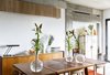 Portuguese dining table by Jose Espinho for Olaio factory and chairs from a hotel in Estoril. The vases over the dining table are old laboratory test-tubes bought in an antic shop at São Bento (Lisbon). Photo 2 of micasaenlisboa modern home