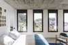 Four windows frame the stunning views of Saint George Castle and Graça Church Photo 5 of micasaenlisboa modern home