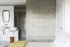 The basin and the tiles on the shower were designed and produced by Maria Ulecia on her atelier. All the blankets were produced in Trinta, a little village close to Guarda, and she ordered also the colorful Cobertores de Papa woven on ancient looms. Photo 8 of micasaenlisboa modern home