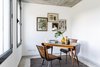 Every room has a small corner where you can sit and write or read or have breakfast. This room has a pair of vintage chairs from the old Café Imperio in Lisbon, and a beutiful table in wood and formica. The rug is a traditional Alentejo shepherd blanket. Photo 11 of micasaenlisboa modern home