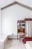 Attic room with bath tub open to the room and great views. Photo 19 of micasaenlisboa modern home
