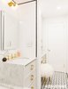 Modern home with Bath Room, Marble Counter, Drop In Sink, Ceramic Tile Floor, Drop In Tub, Open Shower, Wall Lighting, Ceiling Lighting, Subway Tile Wall, Marble Wall, and One Piece Toilet. Bathroom view from window. Photo of Brooklyn Heights Glam Apartment
