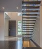 Clean geometry and fascinating shadows make for a space that has a lot of visual interest without being cluttered or overly ornamented. Photo of Shadow on White Pallet modern home