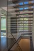 Even under the stairs, one has a good view into the yard. Photo 4 of Shadow on White Pallet modern home