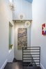 Modern home with Staircase, Wood Tread, and Metal Railing. Stairway (with borrowed light panel to third floor bathroom) Photo 14 of Hobbit House