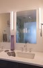 Modern home with Bath Room, Glass Tile Wall, Engineered Quartz Counter, Open Shower, Recessed Lighting, Wall Lighting, One Piece Toilet, Undermount Sink, and Ceramic Tile Floor. Master Bathroom Photo 9 of Hobbit House