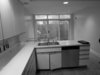 Modern home with Kitchen, Recessed Lighting, Laminate Counter, Laminate Cabinet, Light Hardwood Floor, Range, Refrigerator, Dishwasher, and Drop In Sink. Living Space-BEFORE Photo 19 of Hobbit House