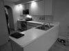 Modern home with Kitchen, Range, Laminate Cabinet, Laminate Counter, Recessed Lighting, Light Hardwood Floor, Drop In Sink, Refrigerator, and Dishwasher. Living Space-BEFORE Photo 20 of Hobbit House