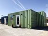 Modern home with Exterior, Flat RoofLine, Shipping Container Building Type, Metal Roof Material, House Building Type, Prefab Building Type, and Metal Siding Material. The 320A Mod features a fully equipped kitchen, bedroom, and bathroom. It also has a spacious living area and is comprised of 320 square feet. Photo of Make it Modular 320A