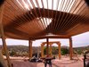 TGI pro 250 roof supports,flagstone floor,New Mexico ponderosa pine post and beams Photo 5 of Picture Rock Studio-Round Strawbale Home design & built by Glen Neff modern home