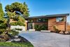 Mid-century, remodeled exterior Photo of Clyde Hill Mid-Century modern home