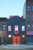 Modern home with Exterior and Shipping Container Building Type. On a tree-lined street in Clinton Hill, Brooklyn, a former carriage house from the 1930s is now a colorful that boasts bright orange shipping containers.
Commissioned by an artist, a gallerist, and their daughter, LOT-EK was tasked with renovating and expanding their existing two-story home. The new design rotates around an extension made out of stacked shipping containers, and features vibrant colors and a centralized-floor plan. As a result, the architecture is now organized around a polychromatic core volume that extends from the ground floor to the roof terrace. Photo 11 of Irving Place Townhouse modern home